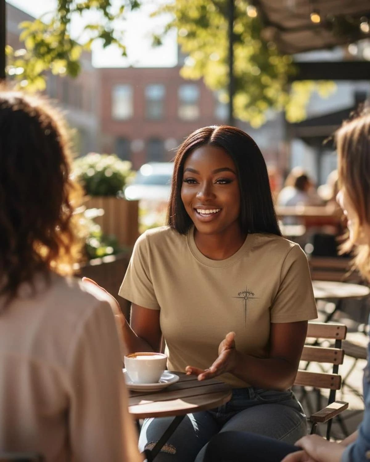Witness Global community member wearing the sand tee