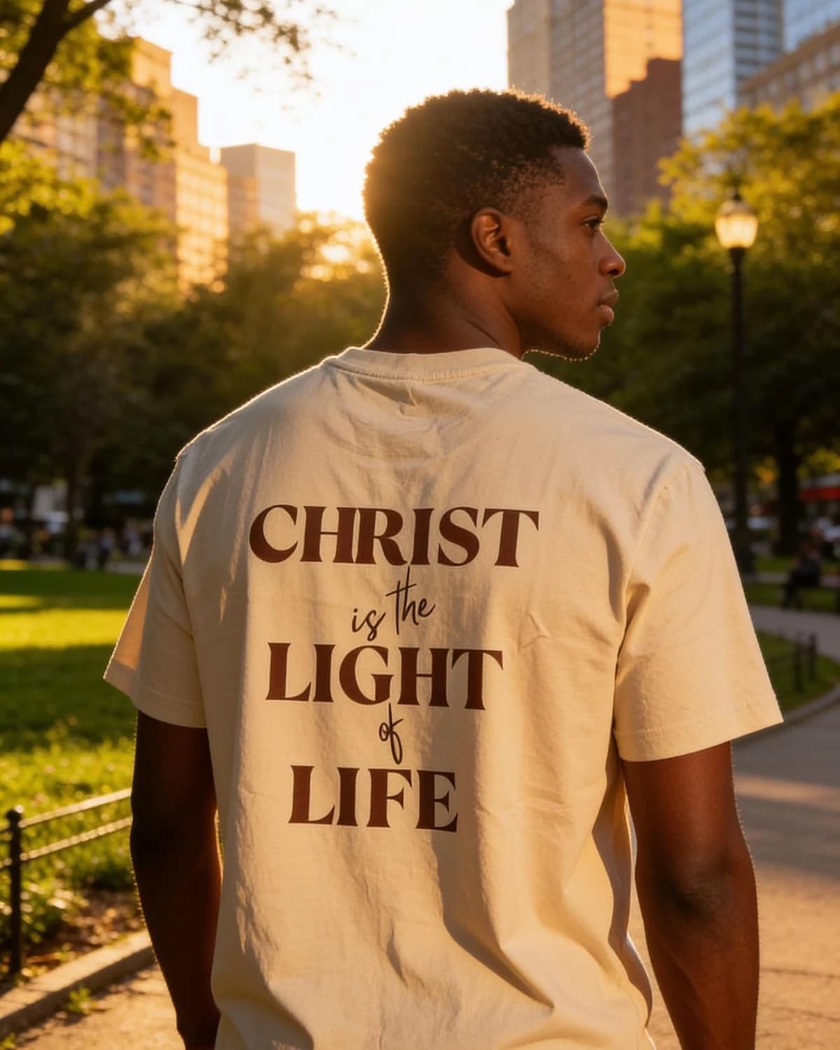 Light of Life sand tee photographed outdoors